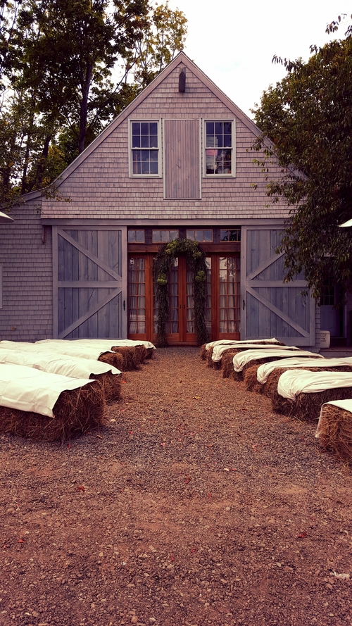 Wedding ceremony in front of the barn.